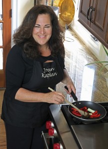 Joan Farbstein Kaplan at stove